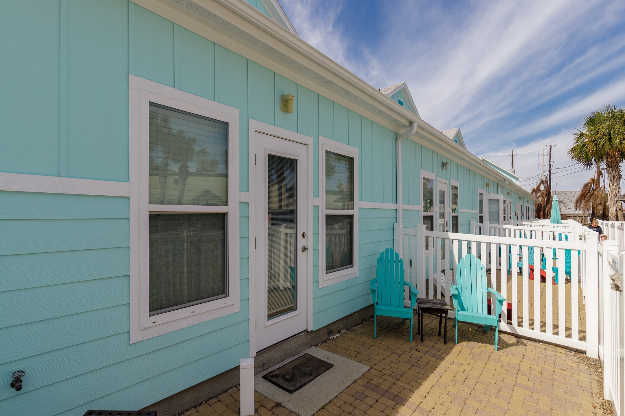 Patio just off the living area enjoys easy access to the pool
