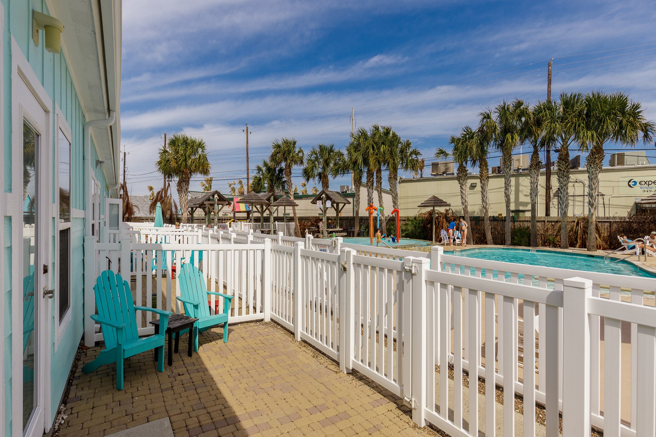 Personal patio off the living and dining area has easy access to the pool right out back