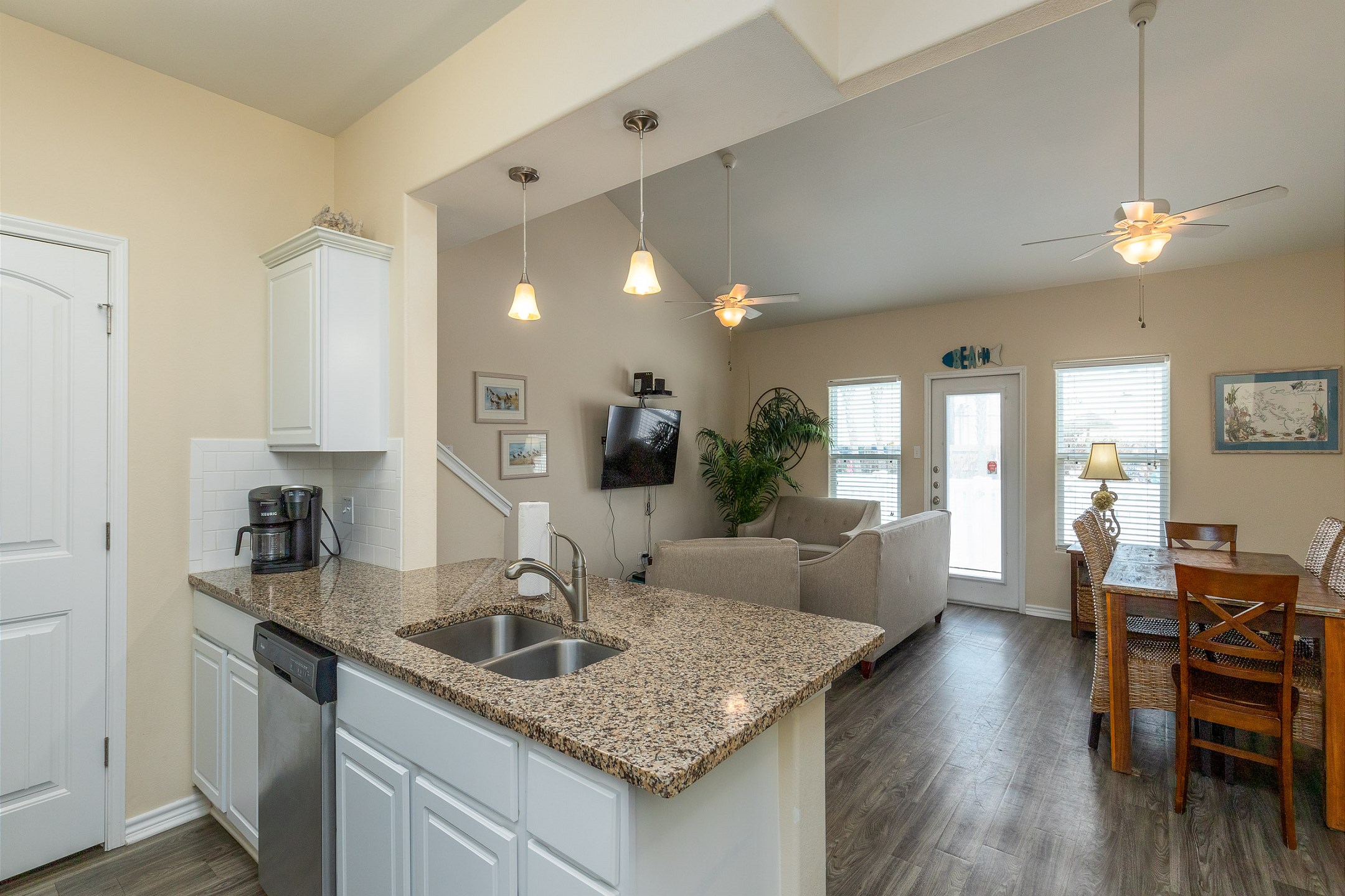 Open-concept layout connecting the dining area to the kitchen