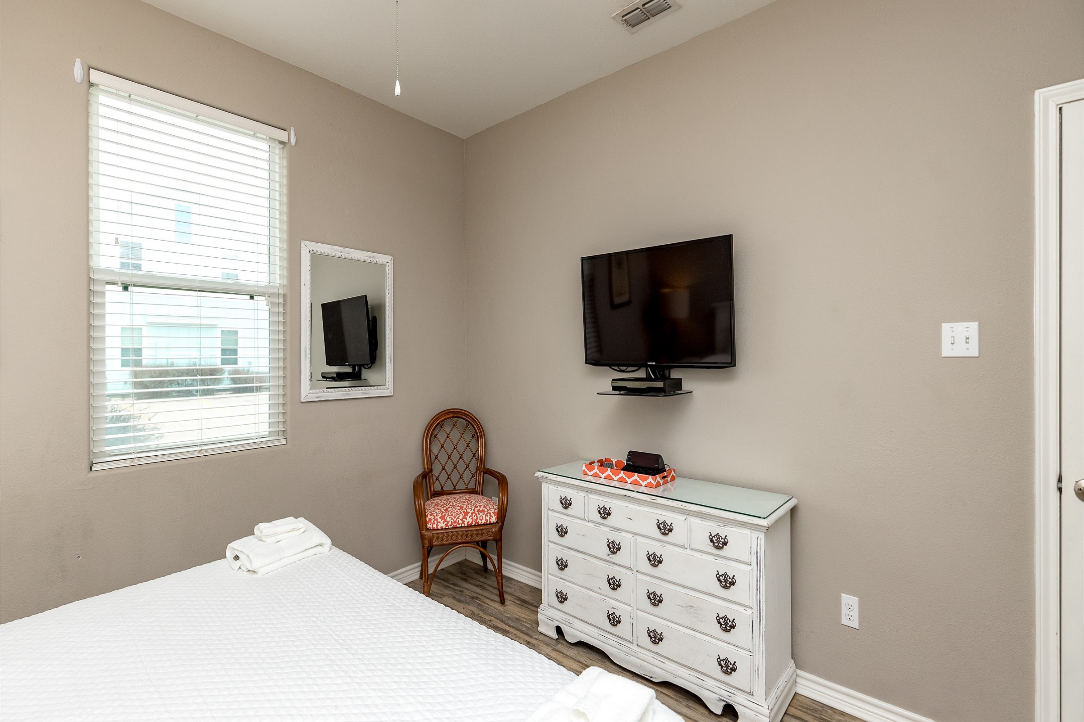 Master bedroom on the first floor with king size bed and flat screen TV