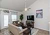 Living area with cozy couches to relax on while enjoying the flat screen TV 