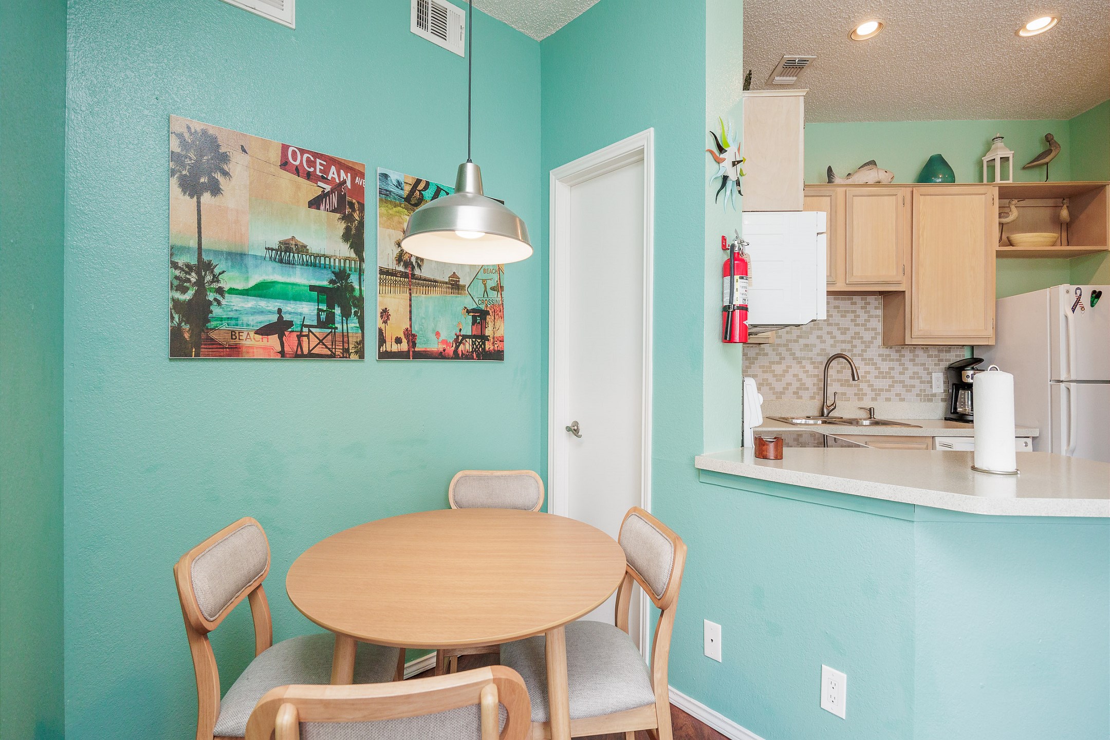 Kitchen and dining area with seating for four