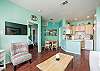 Living area with flat screen TV and plenty of natural light shining in 