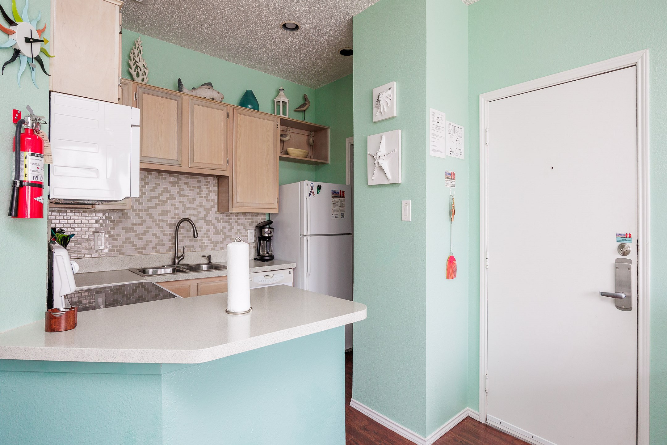 Bright kitchen area with plenty of counter space to prepare family meals 
