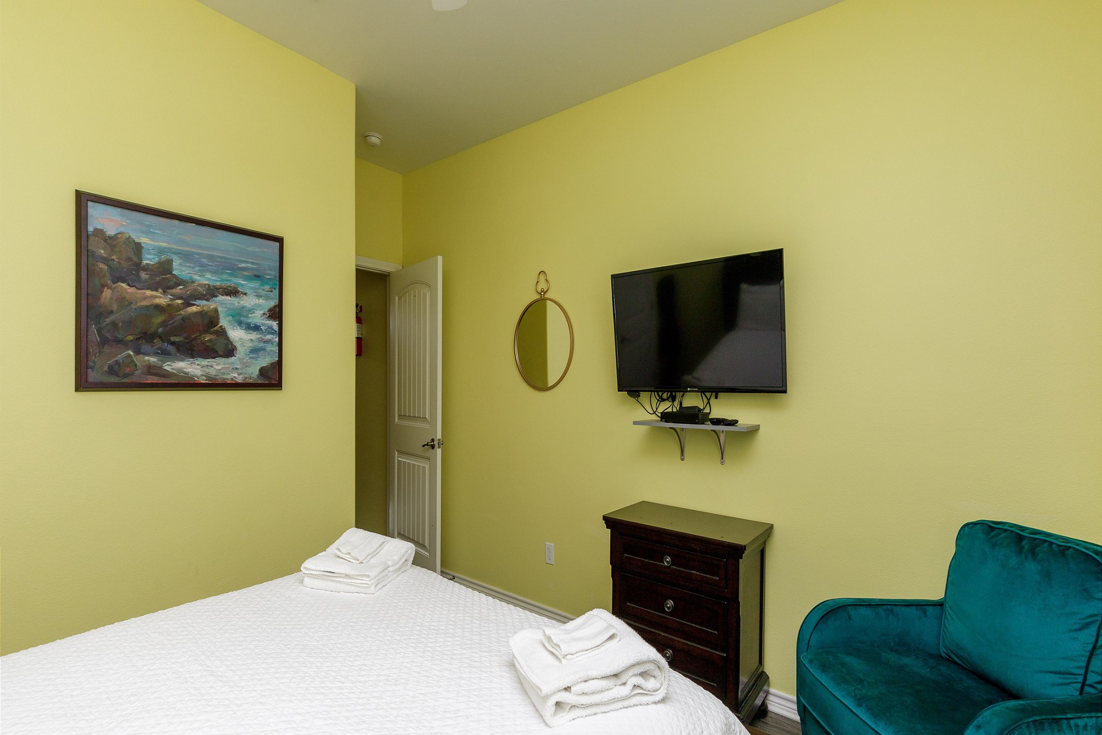Guest bedroom on the second floor with a queen size bed