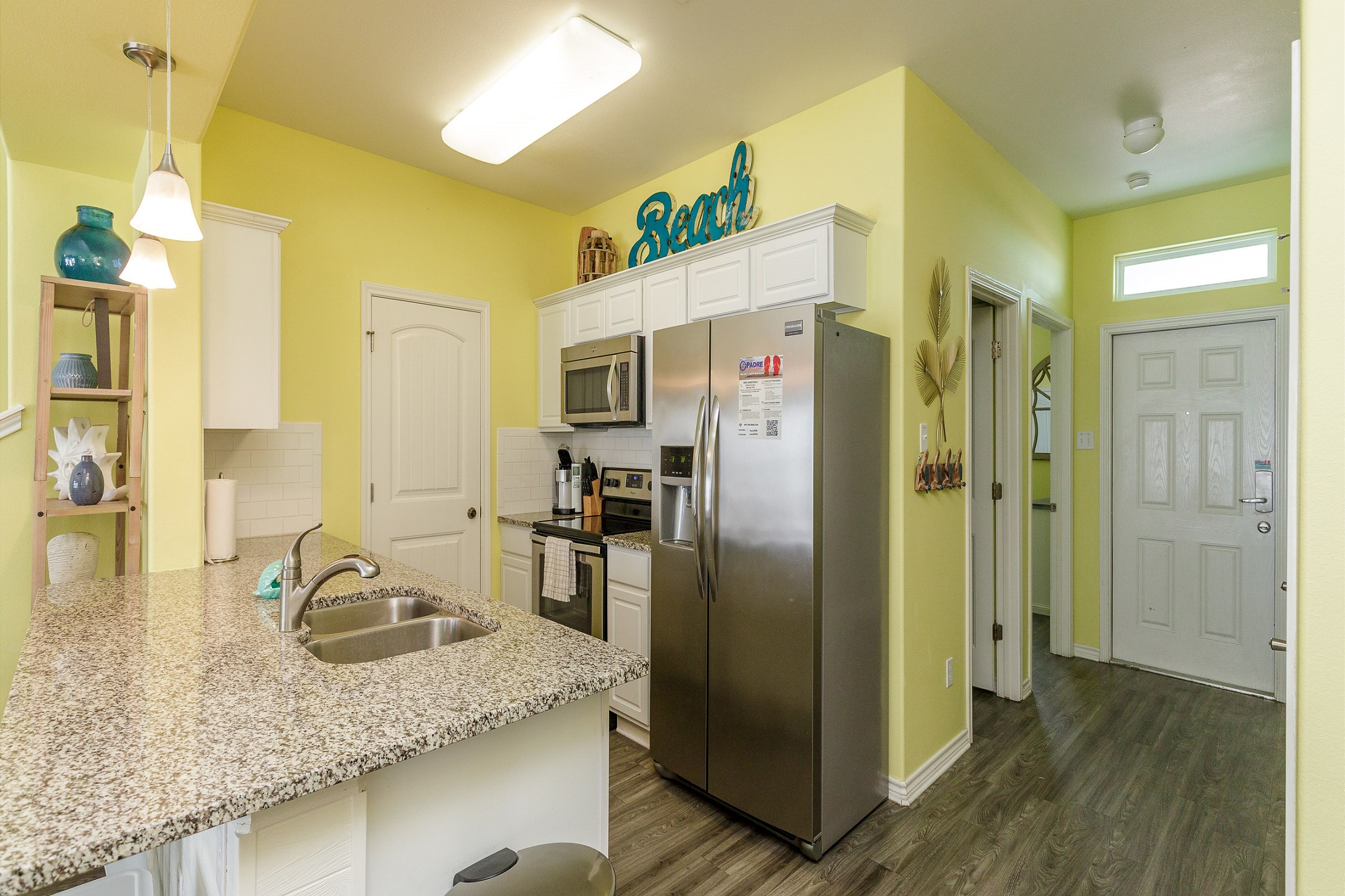 Well-equipped kitchen with stainless steel appliances and ample counter space 