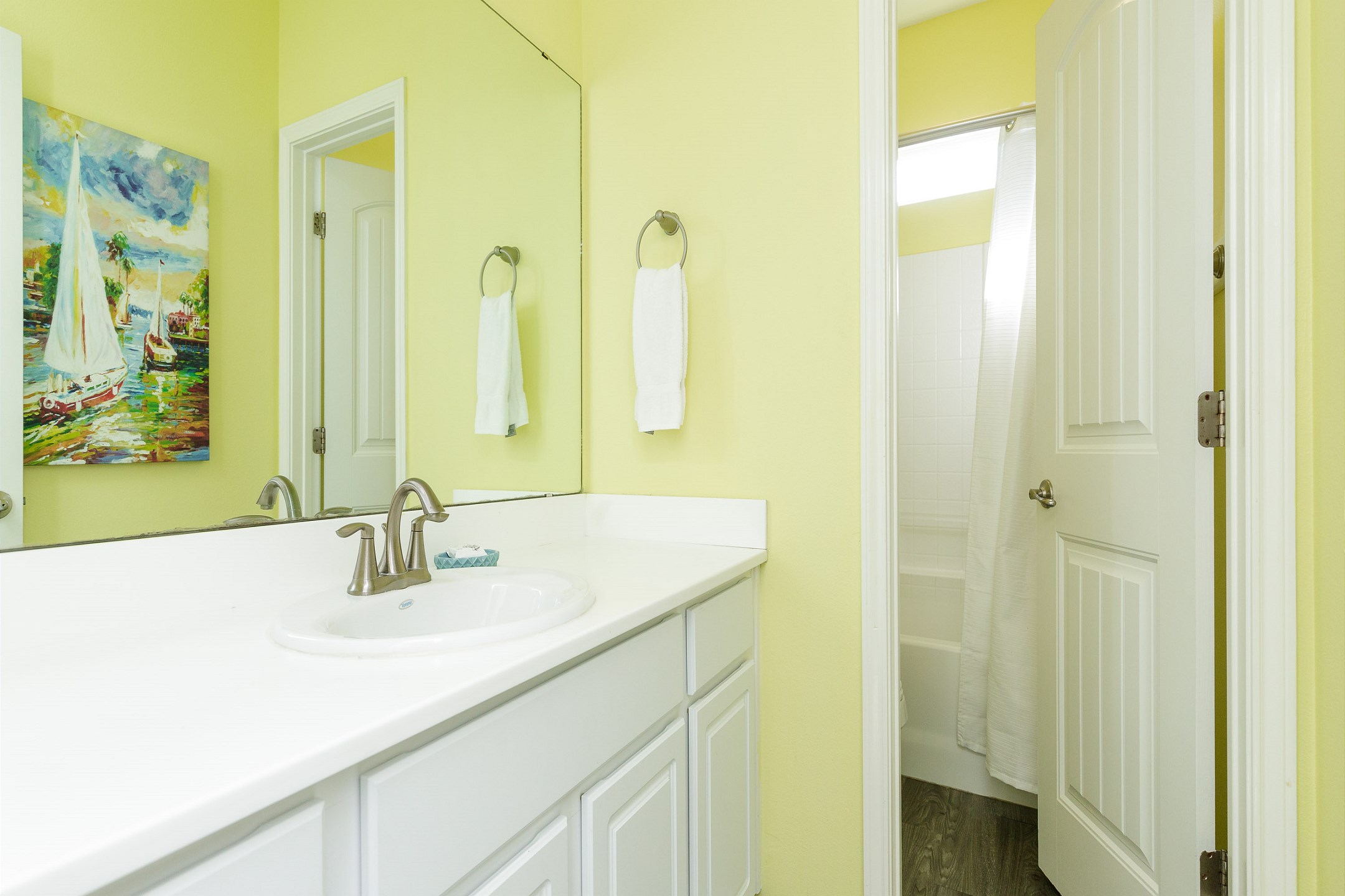 Guest bathroom with tub and shower combo on the second floor