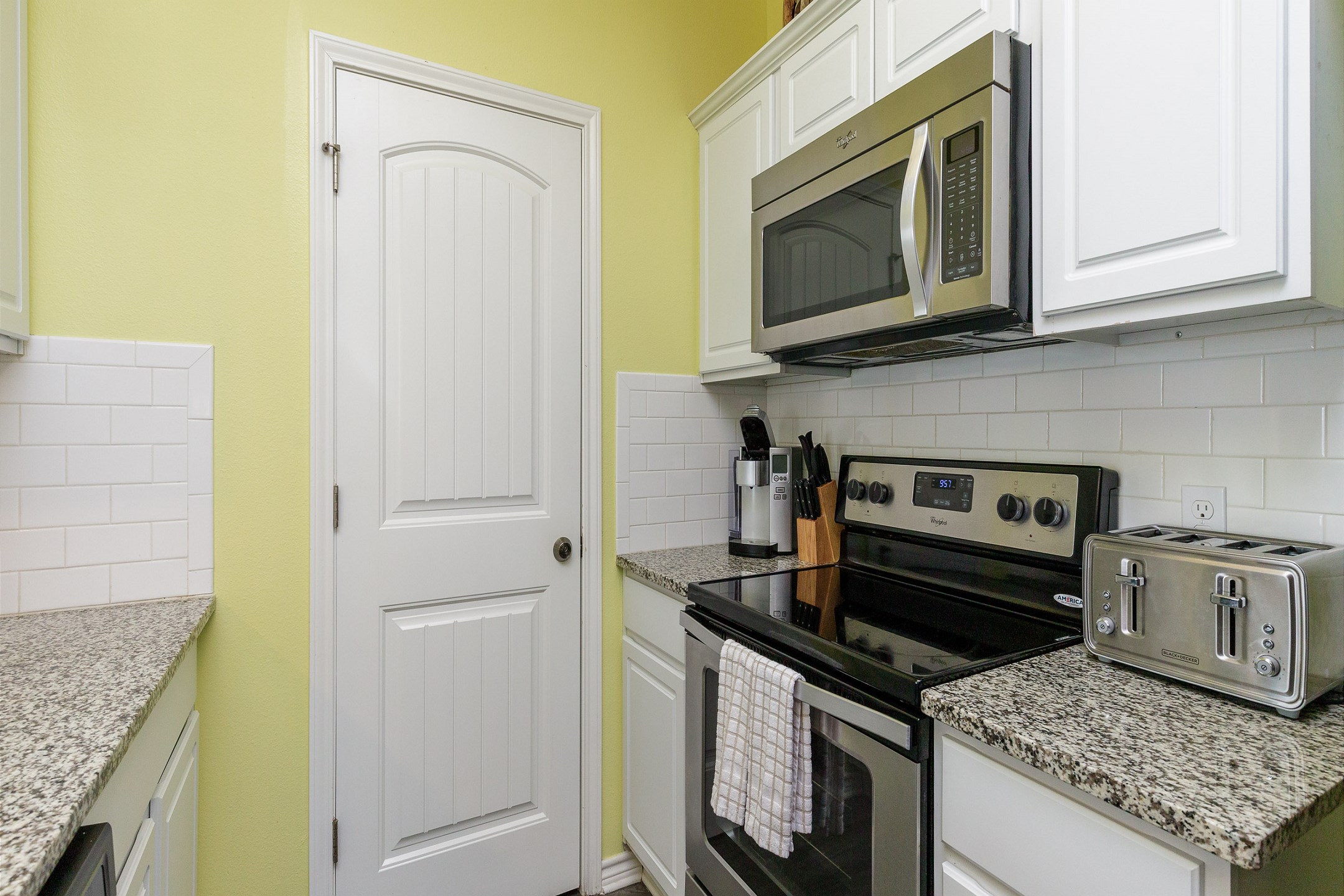 Coffee maker, toaster, cookware, utensils, and dinnerware available for guest use