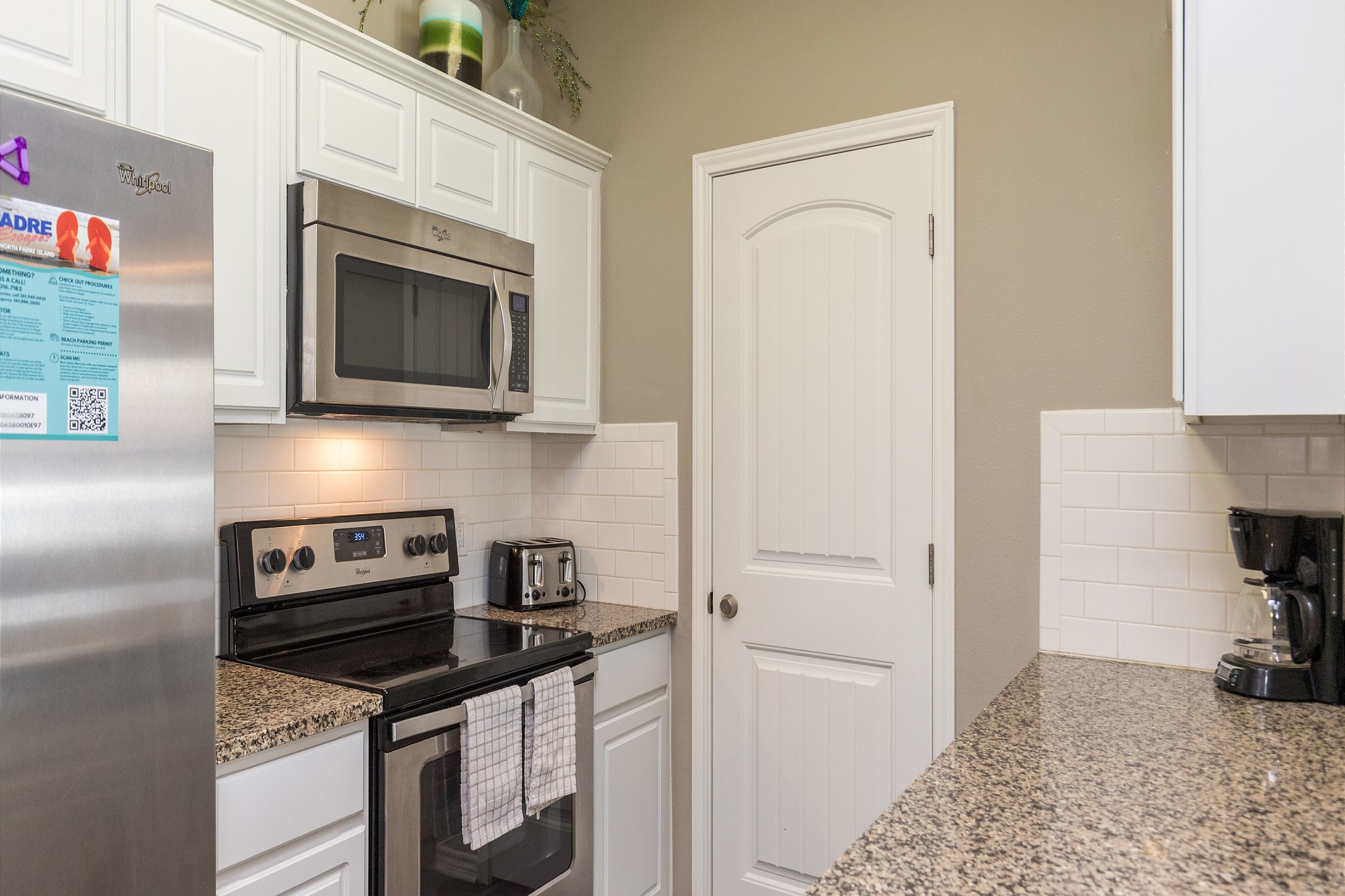 Coffee maker, toaster, cookware, dinnerware, and other kitchen essentials provided