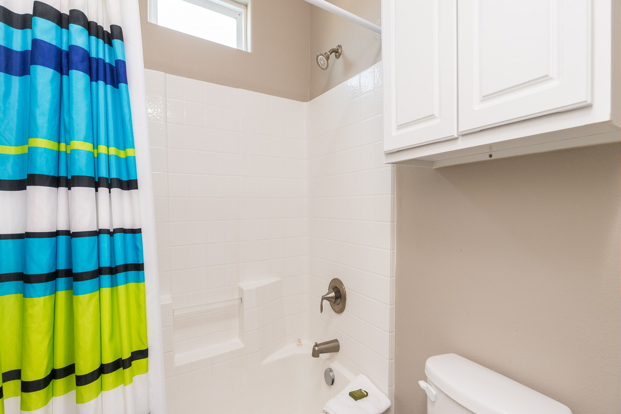 Guest bathroom on the second floor with tub and shower combo
