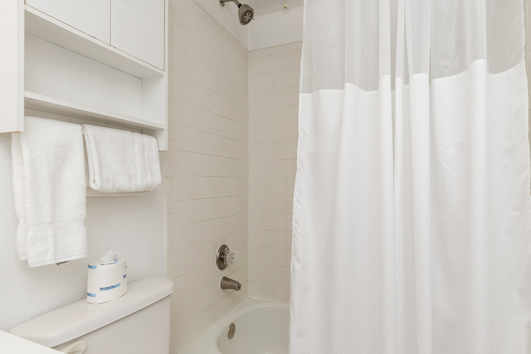Bathroom with tub and shower combo