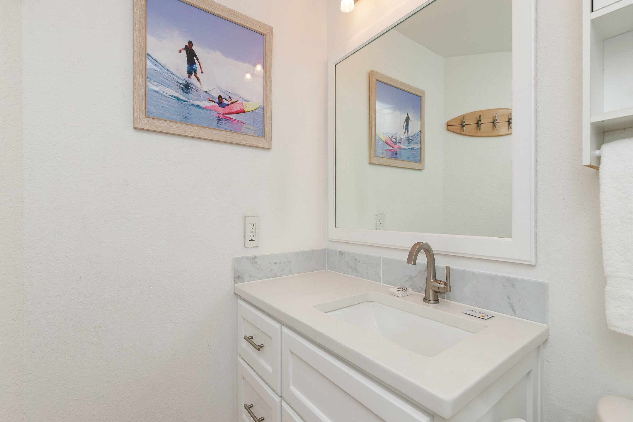 Newly remodeled bathroom with cabinet and vanity 