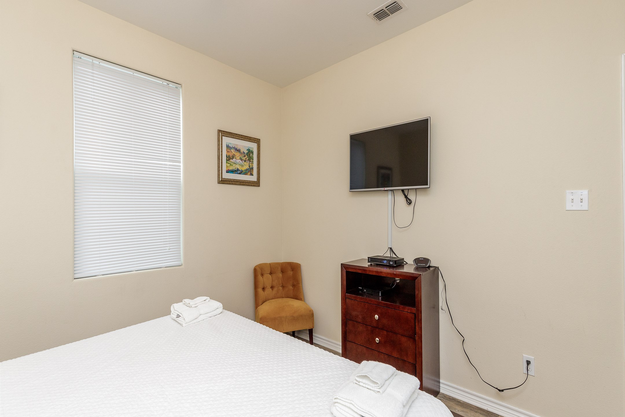 Master bedroom on the first floor with king size bed and flat screen TV