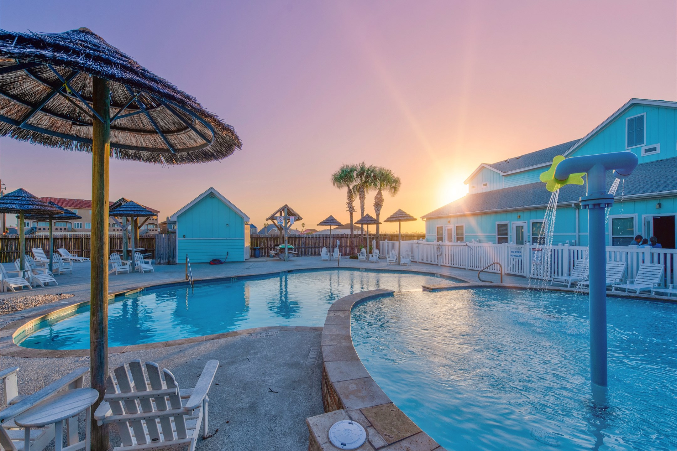 Scenic pool with playful fountains and a vibrant resort atmosphere