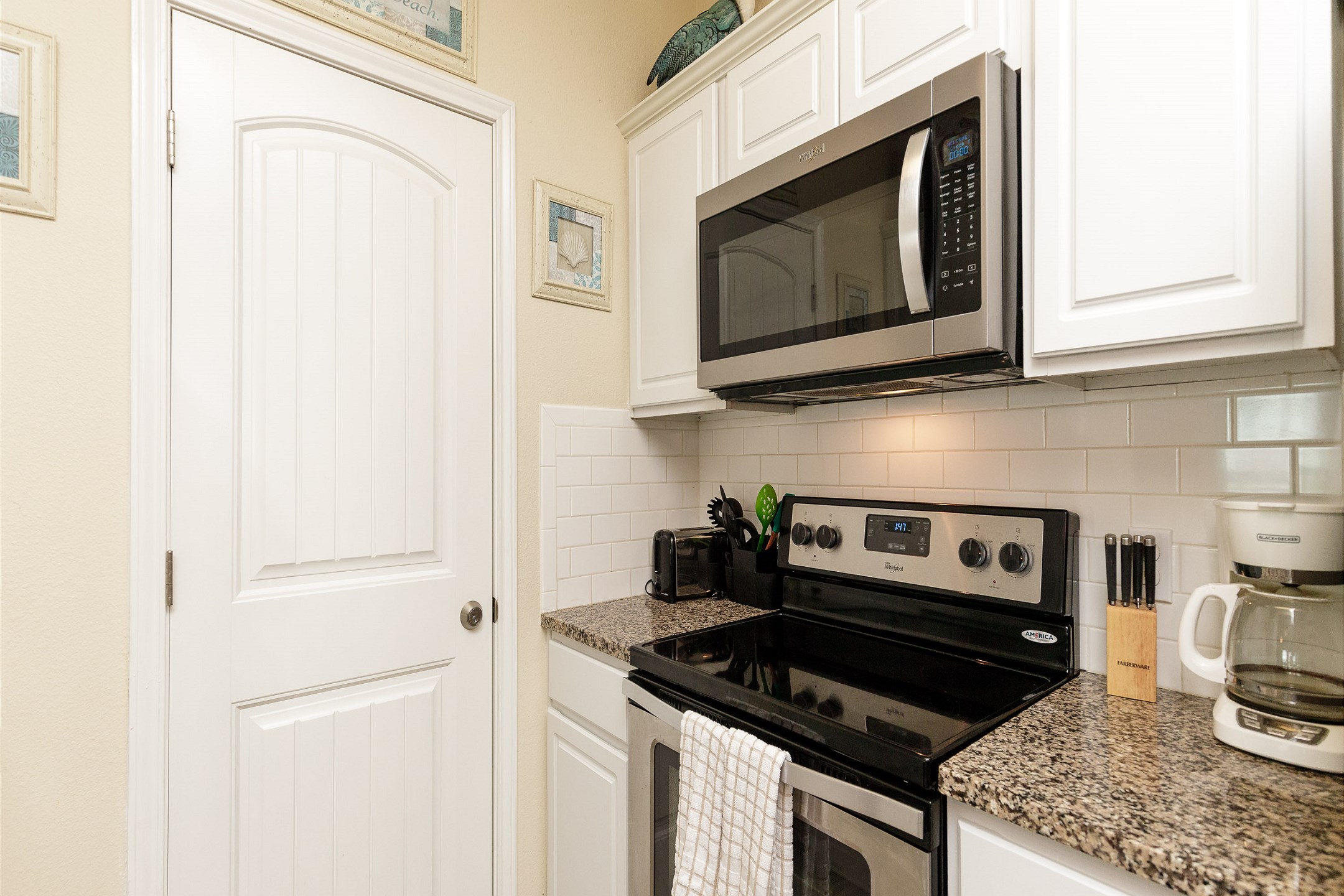 Kitchen area with 12-cup coffee maker, toaster, and other essentials provided