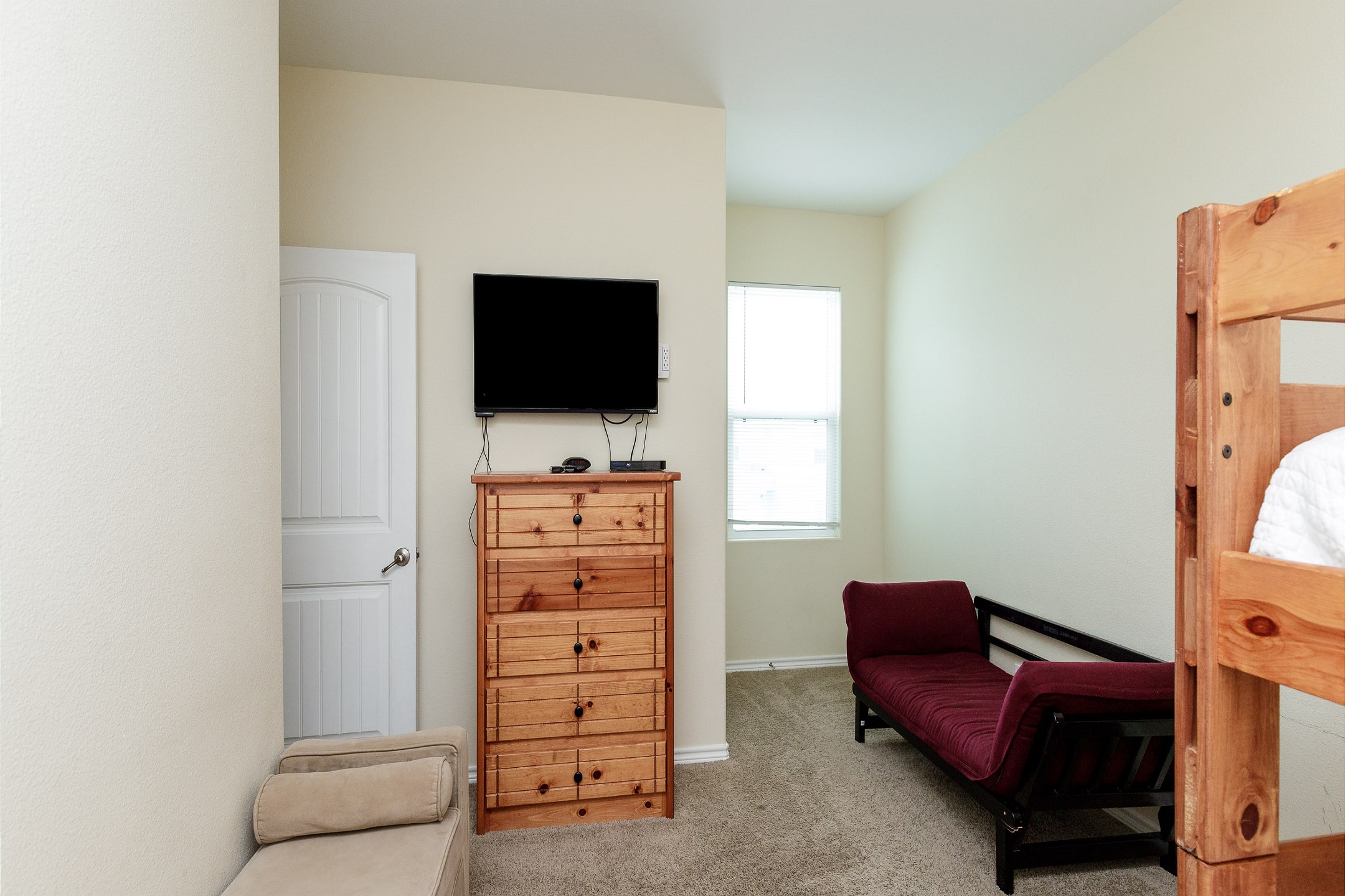 Third bedroom on the second floor with full size bunk beds, twin bed and twin size futon
