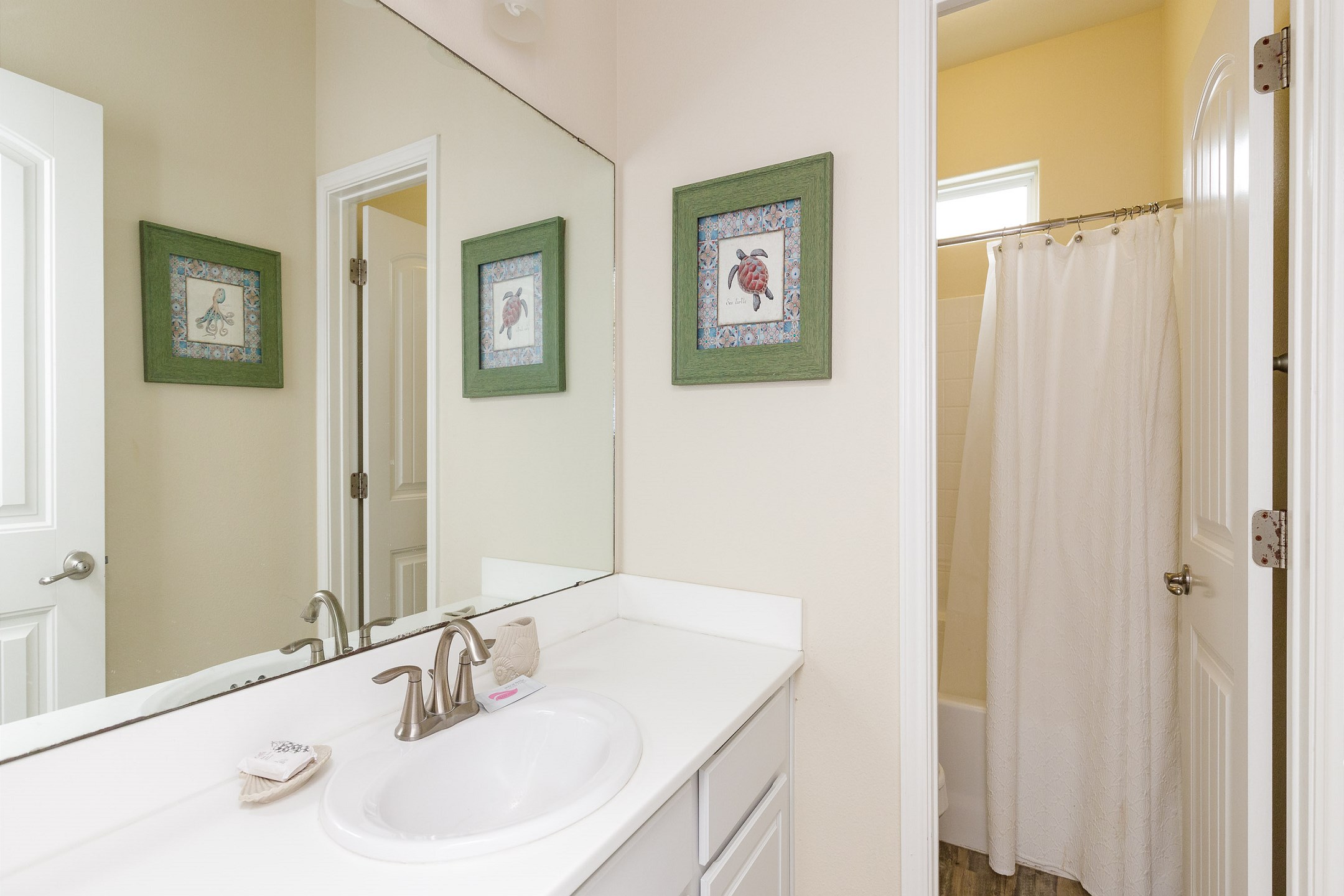 Guest bathroom on the second floor with tub and shower 