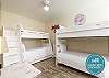 Third bedroom on the second floor with twin over full size bunk bed with twin trundle and twin size bunk beds, along with flat screen TV