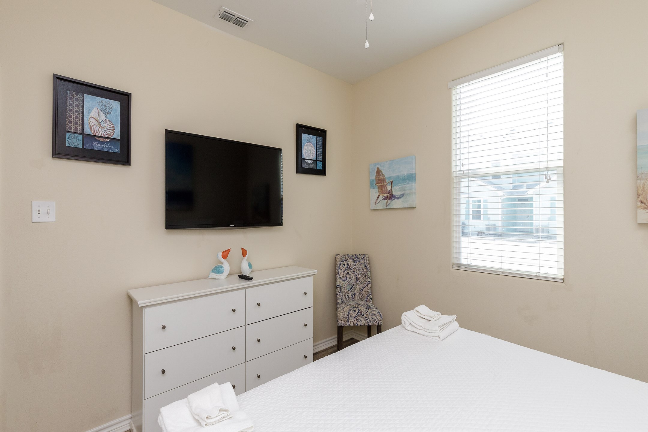 Master bedroom on the first floor with king size bed and flat screen TV