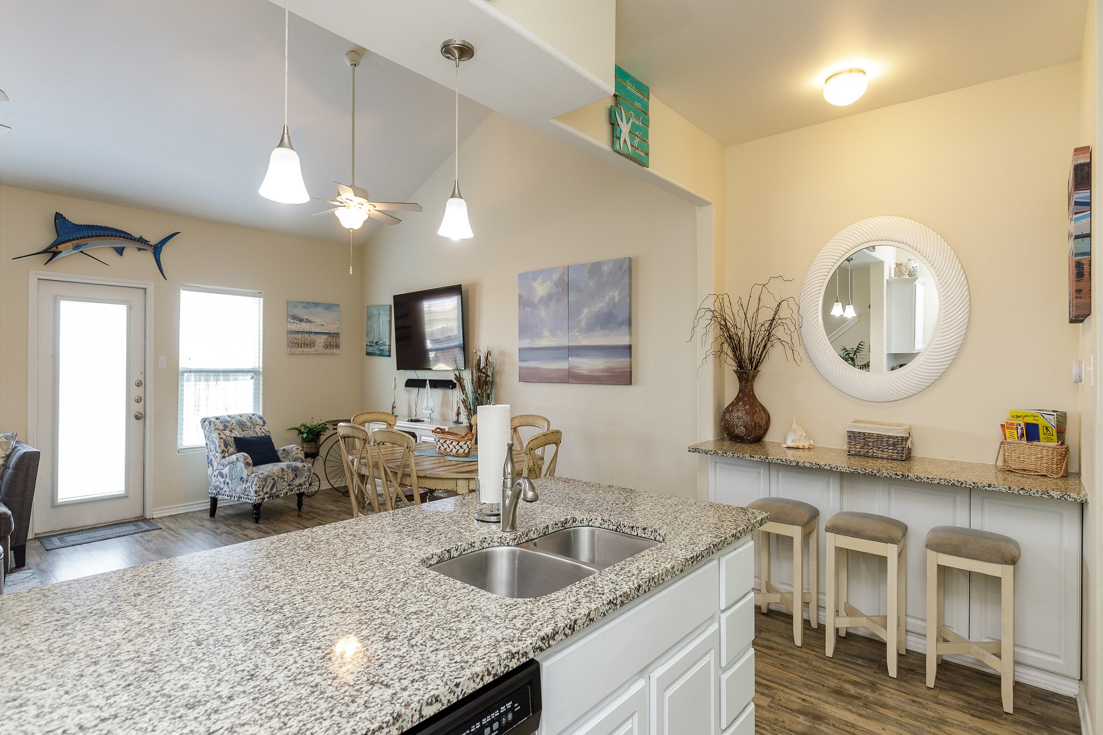 Open concept kitchen area with plenty of seating for the family to entertain while cooking 