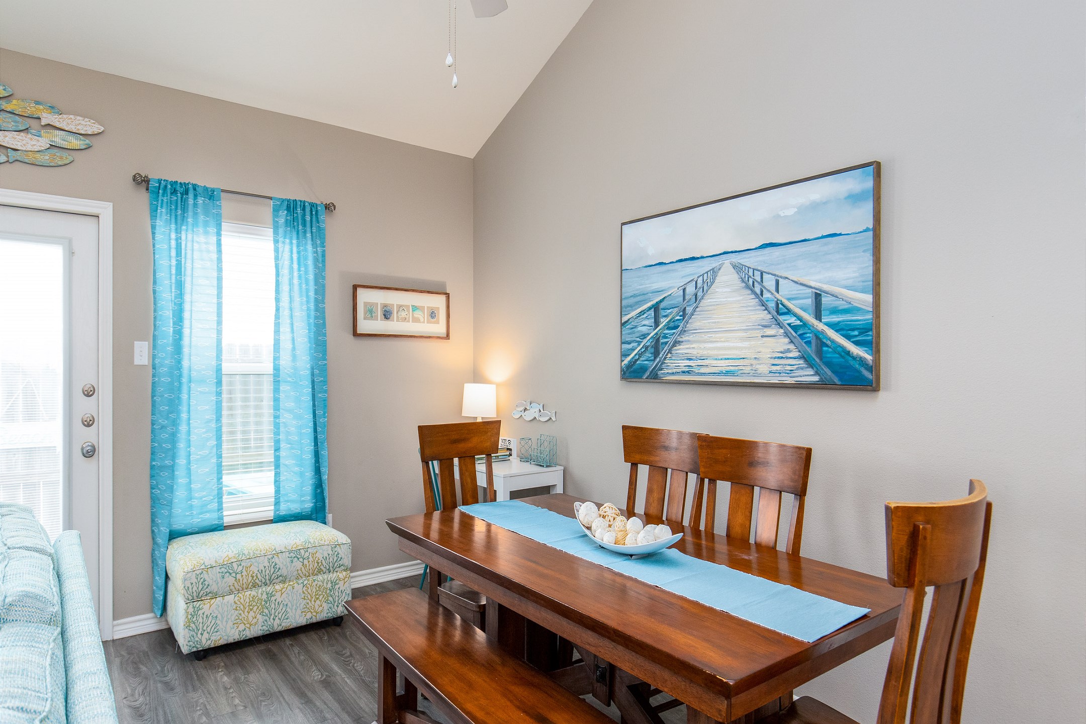 Dining area with four chairs and a cozy bench for extra seating