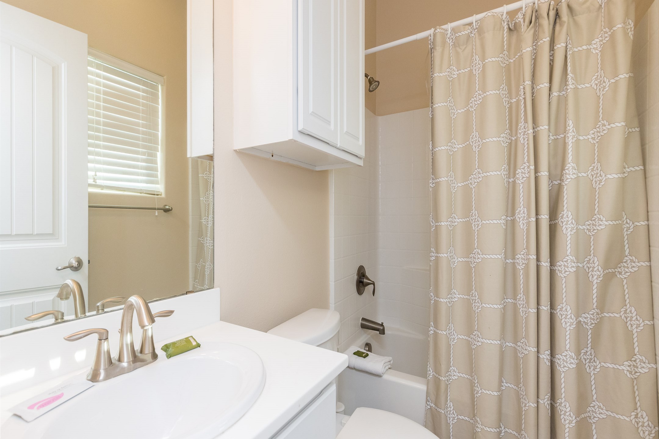 First floor full bathroom with tub and shower combo