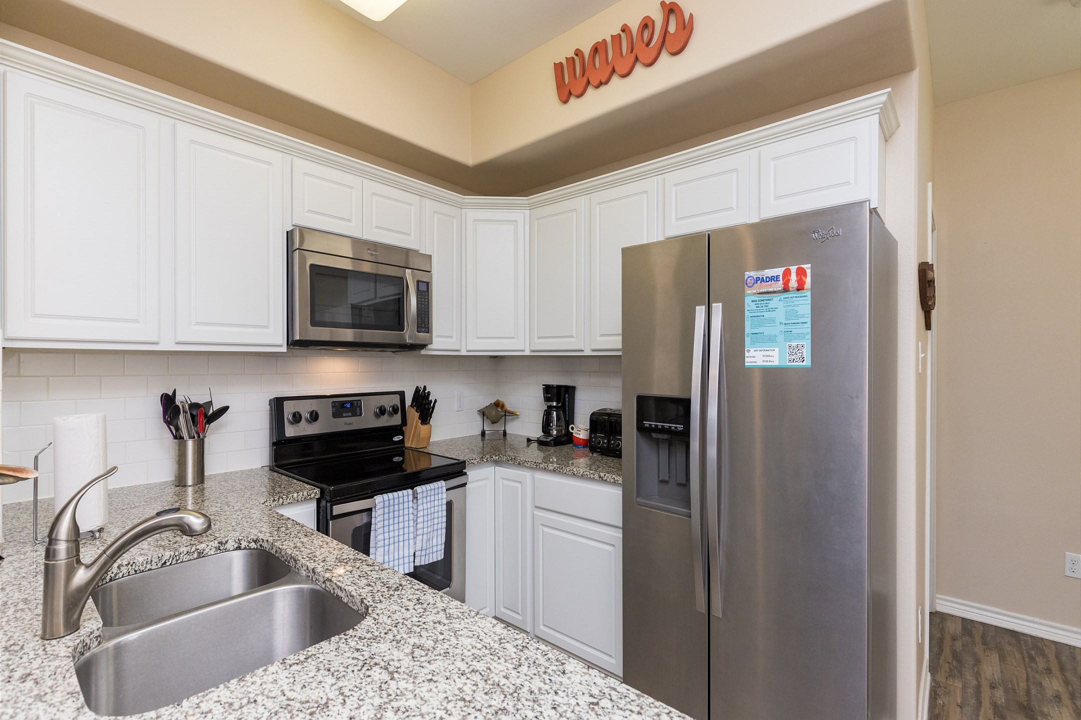 Coffee maker, toaster, cookware, dinnerware, and other kitchen essentials provided