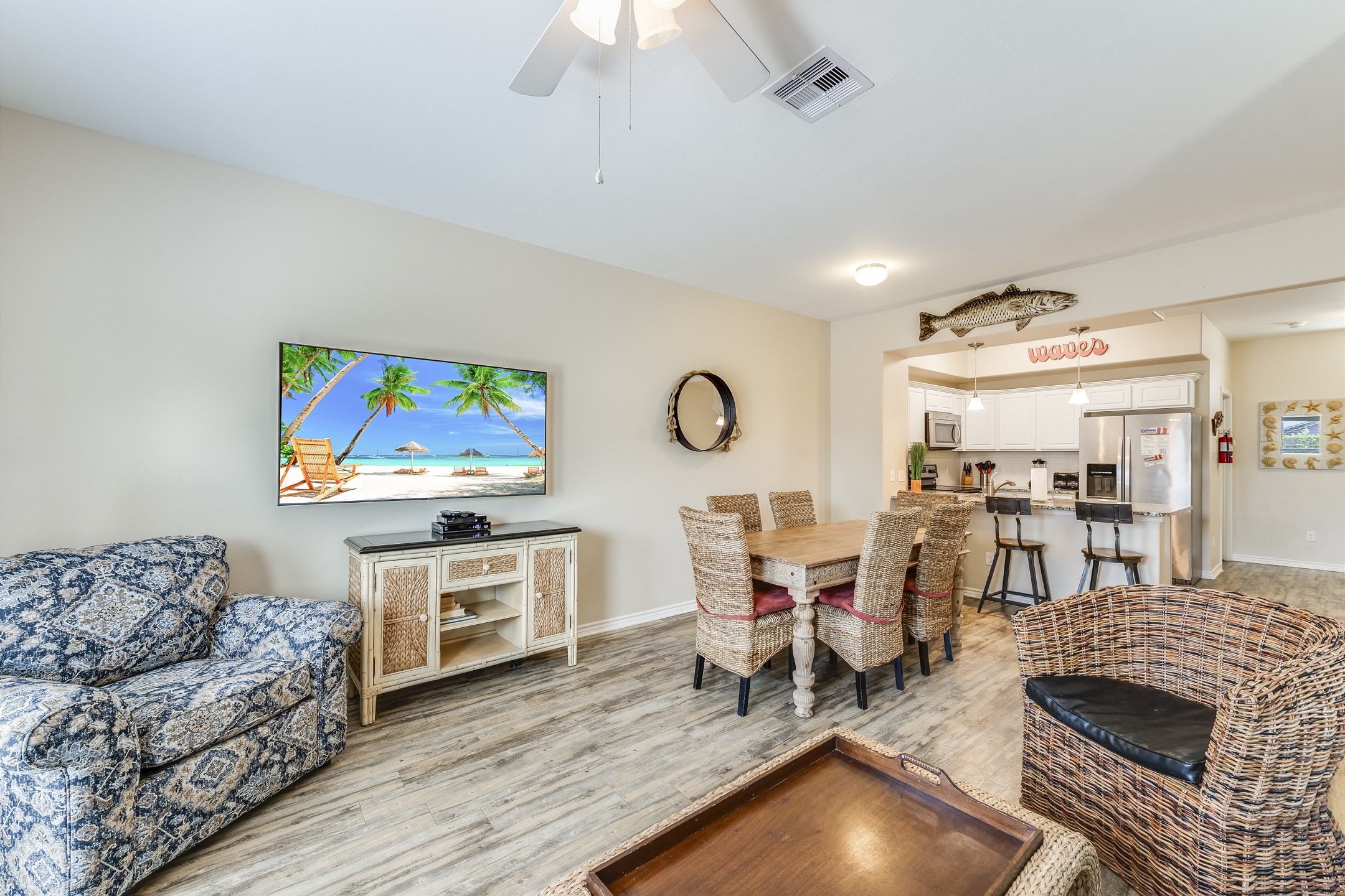 Expansive social area on the first floor with a gourmet kitchen, formal dining area, and plush living room