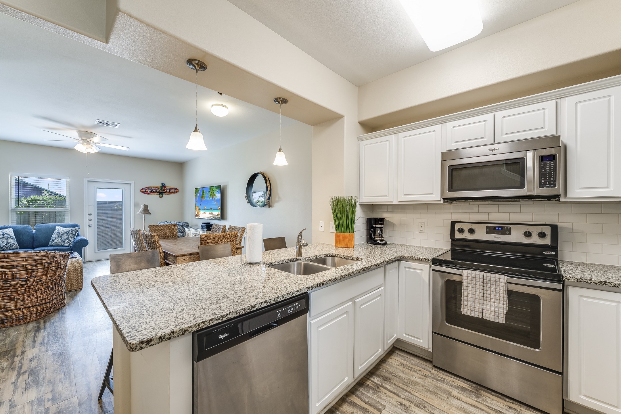 Stylish kitchen equipped with granite countertops and abundant space for crafting delicious meals