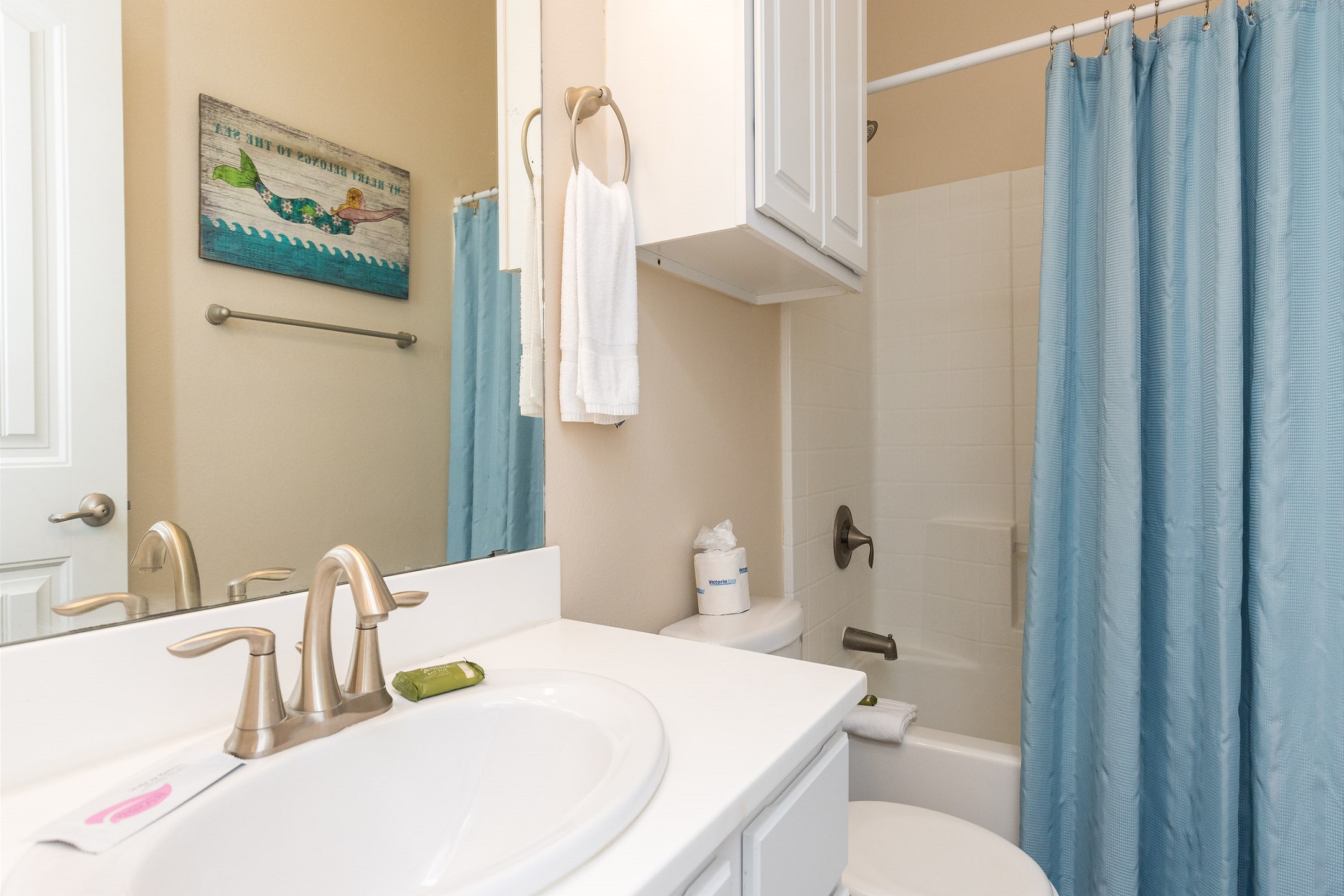 Bathroom attached to the second bedroom with tub and shower combo