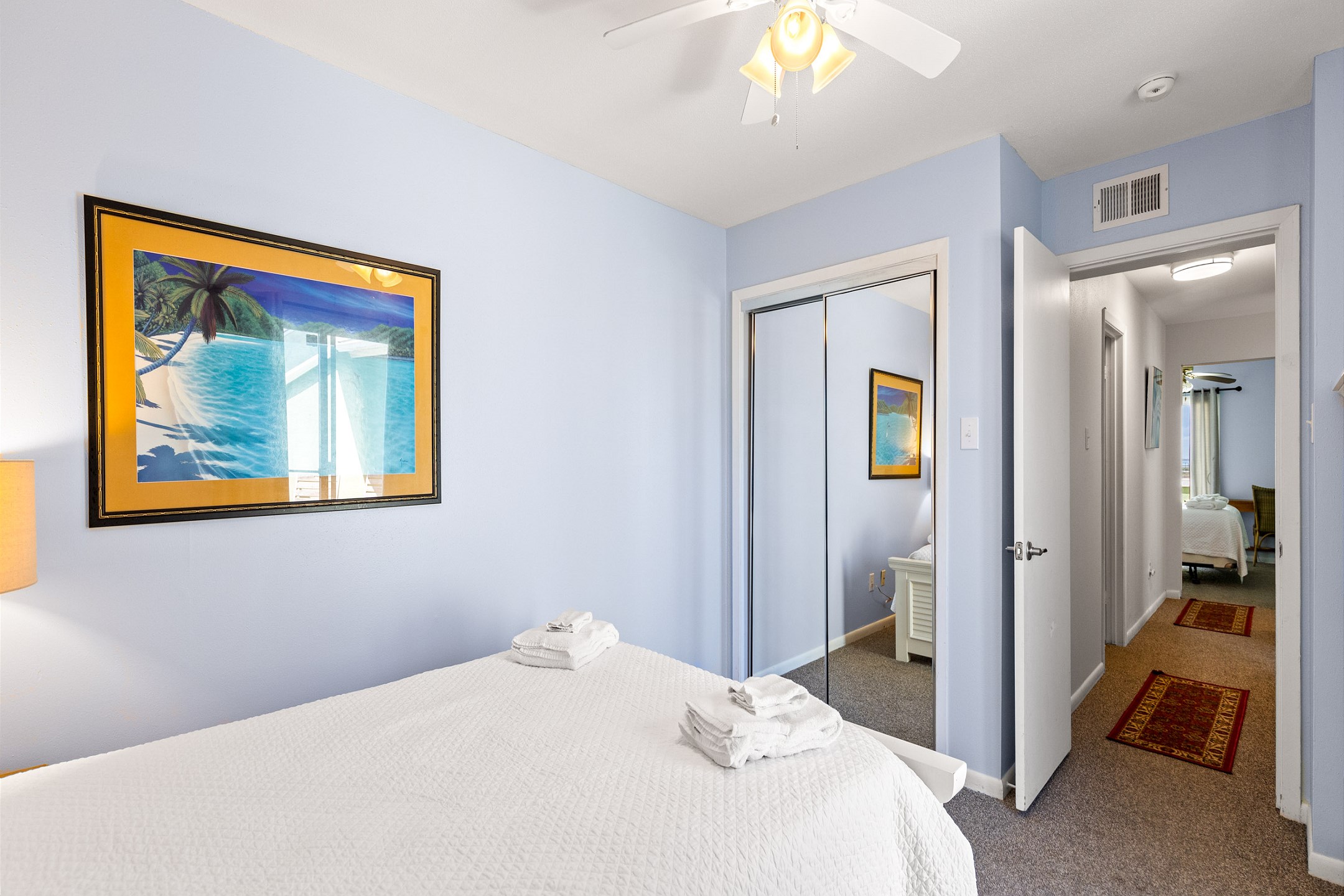 Third bedroom with a full-size bed, twin trundle, and private balcony access for added comfort and relaxation
