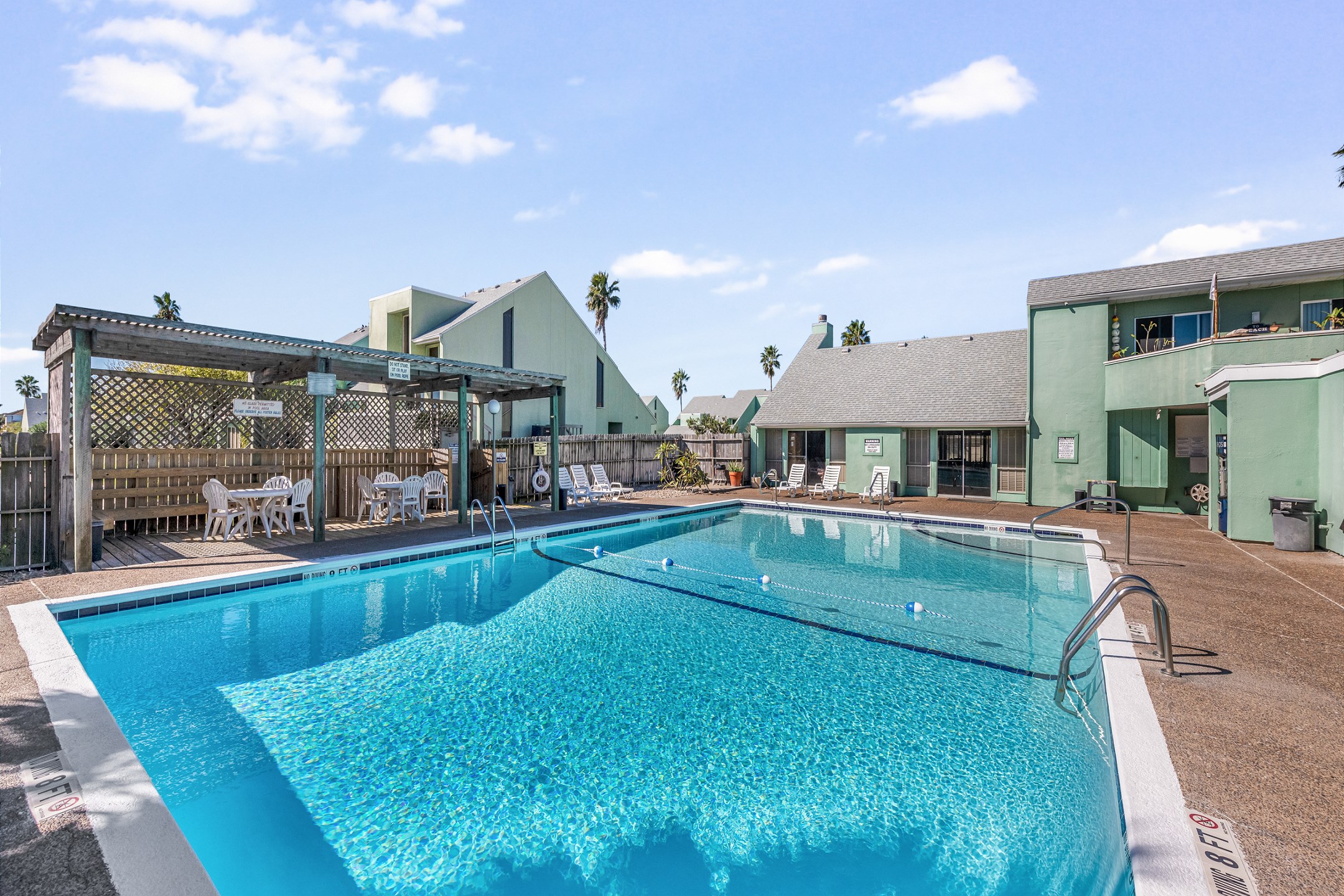 Elevate your vacation and indulge in our community pool offering plenty of seating and tables