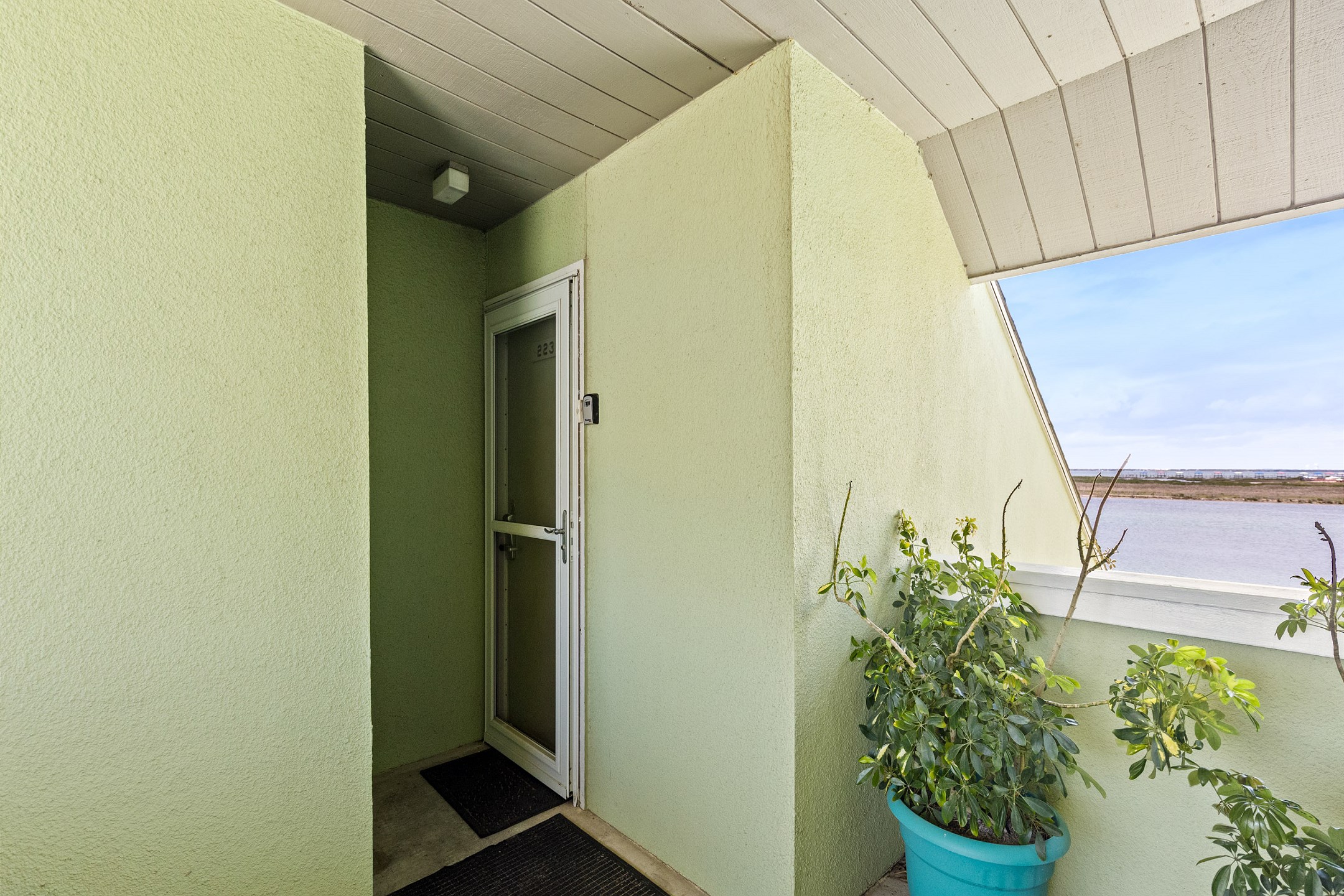 Front door to your condo on the second floor with beautiful water views - only stairs available