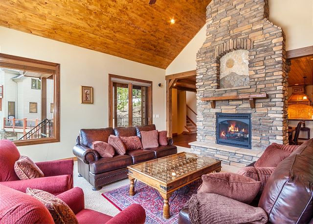 with warm fireplace and access to upper deck