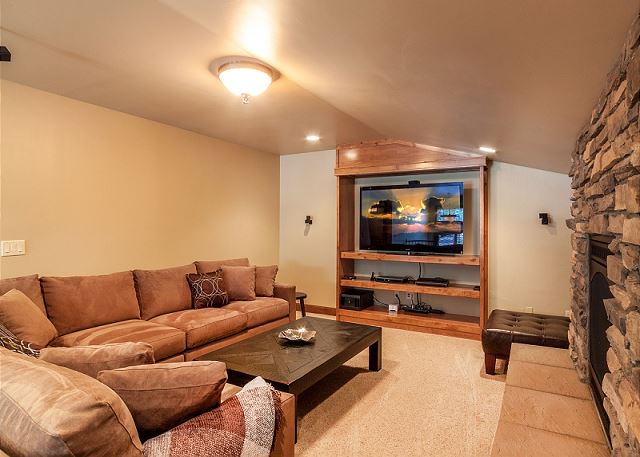 with TV, Gas Fireplace and Foosball (not shown). Comfy sofa converts into a queen sleeper for two.