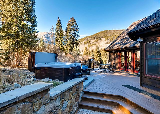 Very Private Deck located off the back of the home featuring Hot Tub, Fire Pit and Outdoor Seating
