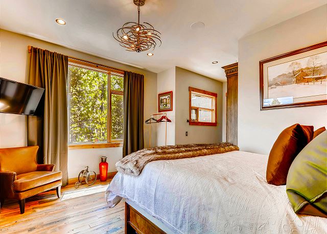- features a TV, cozy furnishings and plenty of closet space
