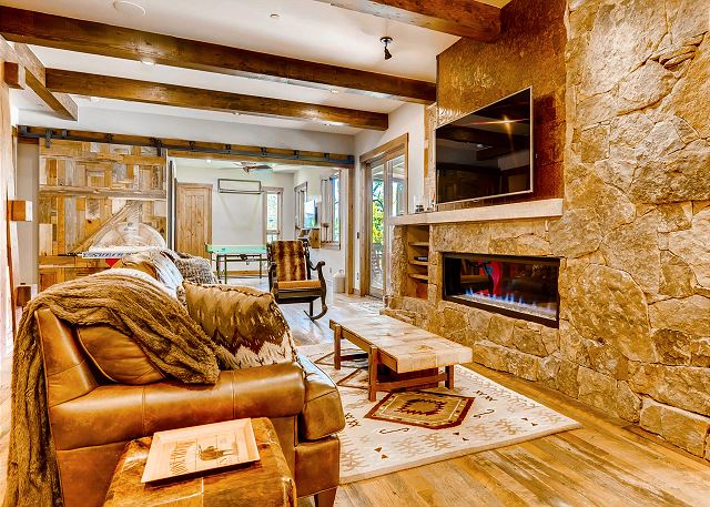 abound in this lower den. Add ping-pong and foosball with a billiards table for plenty of fun hangout moments.
