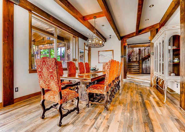on main level open to kitchen with additional bar seating for 4