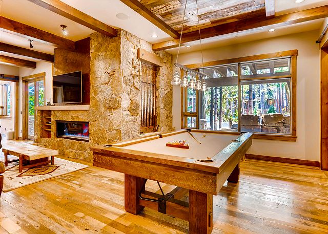 billiards with large wet bar and comfy couch relaxation options. Just adjacent to this room, find the soundproof theater room!
