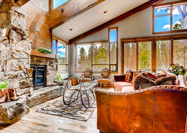 living room with fireplace and open concept to kitchen and dining on main level