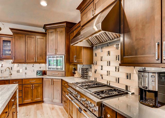 features a Thermador gas stove and oven