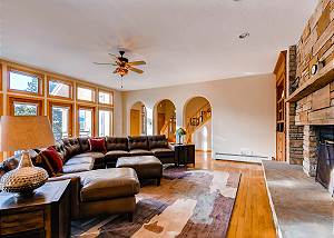 Large Great Room with wood-burning fireplace and views of the mo