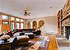 Large Great Room with wood-burning fireplace and views of the mo