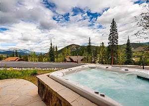 Private outdoor hot tub on lower level patio
