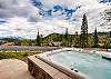 Private outdoor hot tub on lower level patio