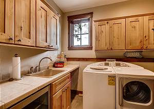 Laundry room with popcorn maker and wine fridge