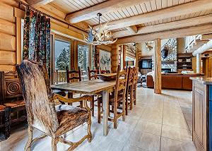 Dining looking to living room and upper deck access