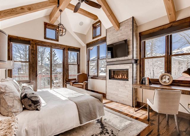features TV, cozy fireplace, work desk, private deck and beautiful views
