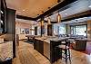 Mid level lounge area with wet bar
